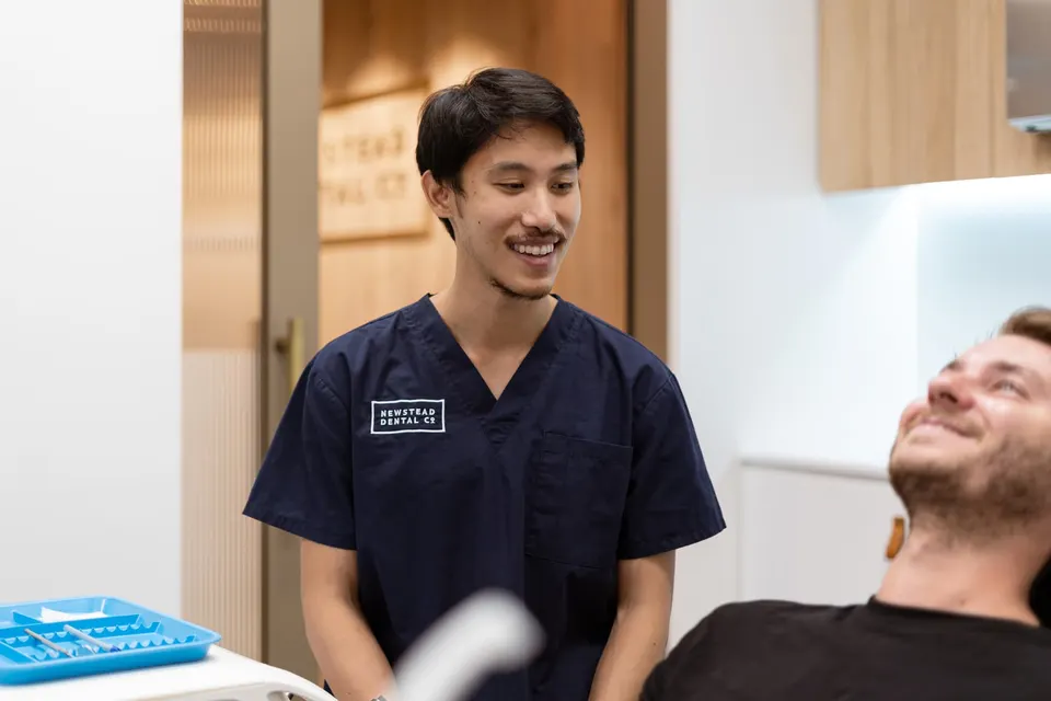 Dentist and patient discussing dental decision-making at Newstead Dental Co