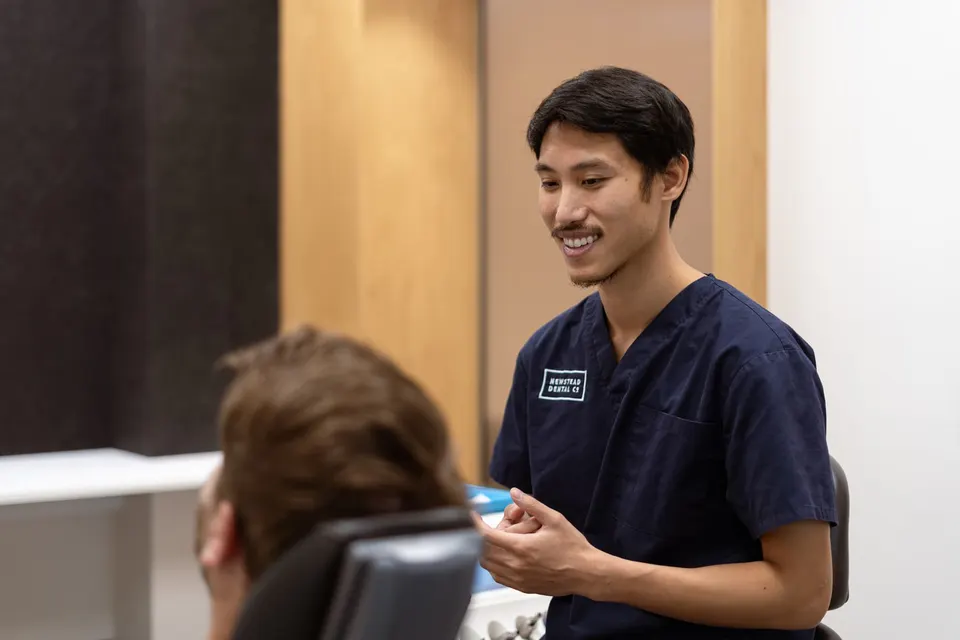 Dentist discussing whether a tooth can be saved